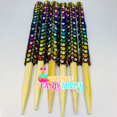 a group of multicolored toothpicks sitting on top of each other