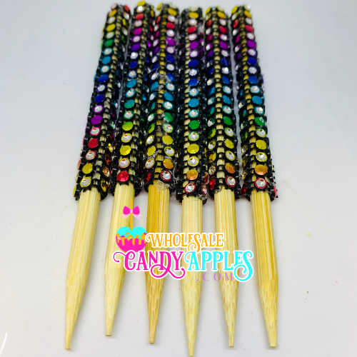 a group of multicolored toothpicks sitting on top of each other