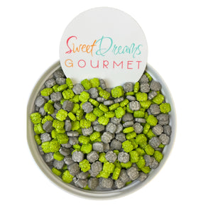 a bowl filled with green and gray candy