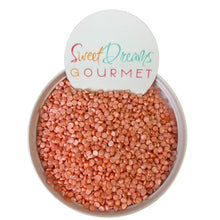 a bowl filled with red lentils next to a sign that says sweet dreams go