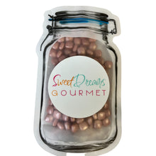 a jar filled with chocolate covered candy beans