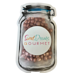 a jar filled with chocolate covered candy beans