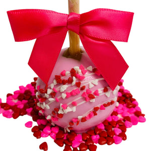 a candy covered in pink and red sprinkles