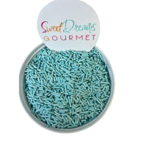 a bowl filled with blue sprinkles and a sign that says sweet dreams