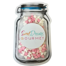 a jar filled with pink and white hearts