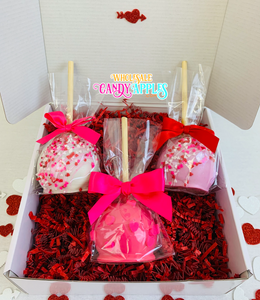 a box of valentine's day treats with a pink bow