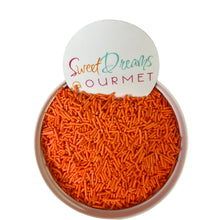 a bowl filled with carrots next to a sign that says sweet dreams gour