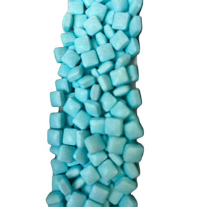 a large pile of blue marshmallows on a white background